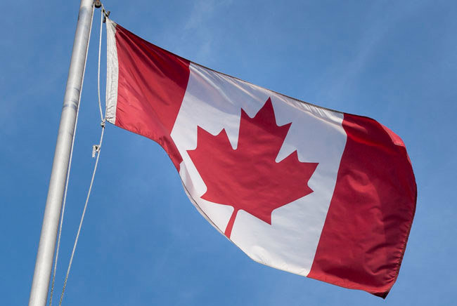 Canada’s flag raised on a flagpole